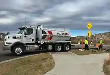 belfor environmental workers with vacuum truck