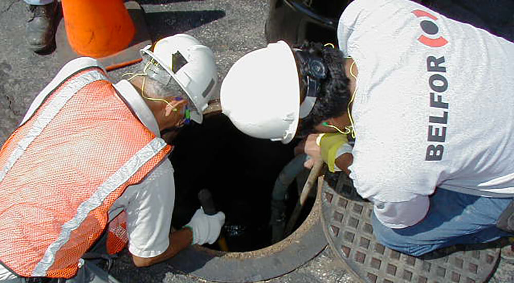 BELFOR Environmental working in a confined space