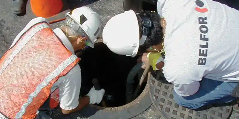 BELFOR Environmental at confined space hole